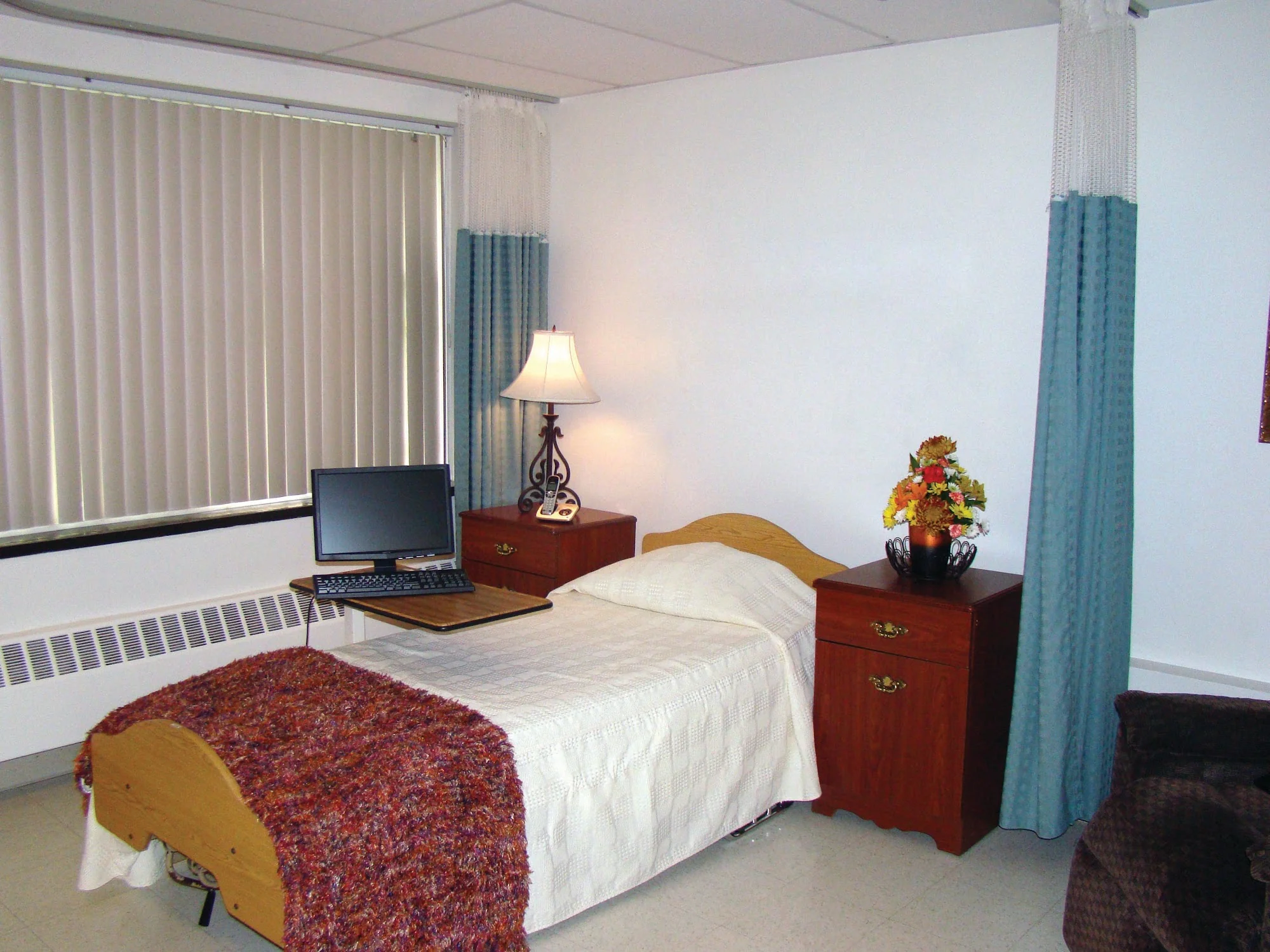WOLCOTT HALL NURSING CENTER INC